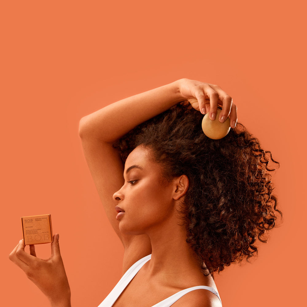 Caring for Your Scalp: A Key to Healthy Curls Curly Girl holding the Moisturizing Shampoo Bar
