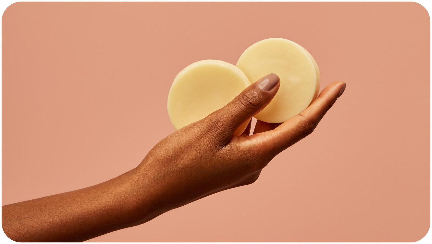 How To Use a Conditioner Bar Woman who knows how to use conditioner bar holds two pieces of Bars Over Bottles conditioner bars