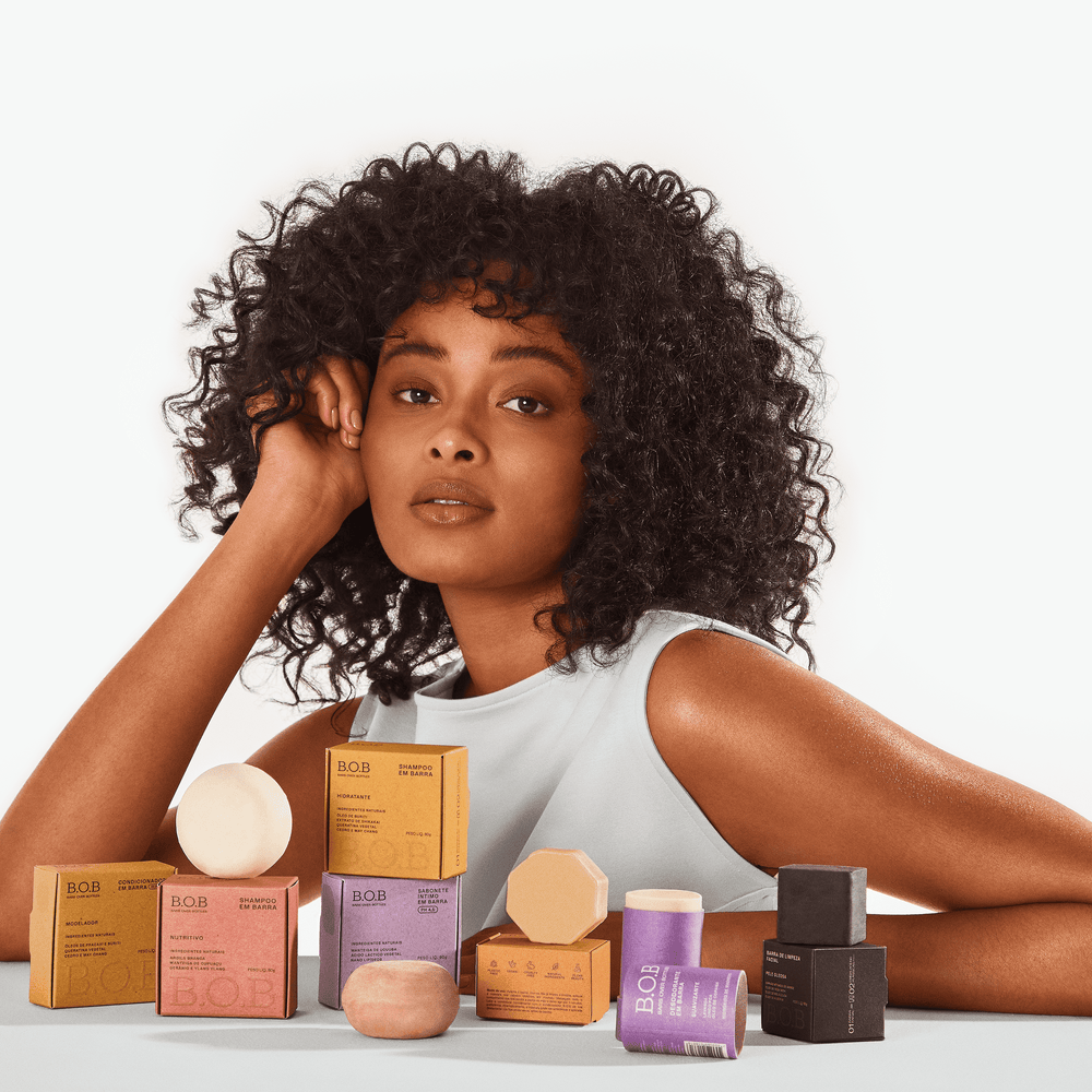 Girl standing next to Bars Over Bottles products
