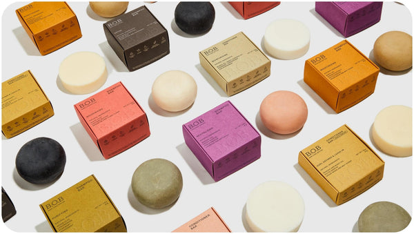 Flat lay shot of Bars Over Bottles best shampoo and conditioner bars for curly hair